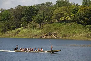 Images Dated 28th March 2008: Panama, Chagres River, Tourists in dug out canoe
