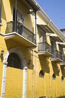 Panama City Gallery: Panama, Panama City, Woman standing on balcony in Casco Viejo (San Felipe)