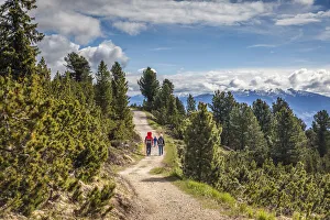 Couple Gallery: Panorama trail on the Schwarzseespitze (2069 m) with a view towards the Bolzano Basin