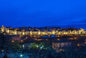 Panoramic night view of the medieval city walls illuminated, Avila, Castile and Leaon