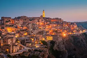 Basilicata Prints: Panoramic view of Sasso Caveoso of Matera at dusk. Matera, Basilicata, Italy