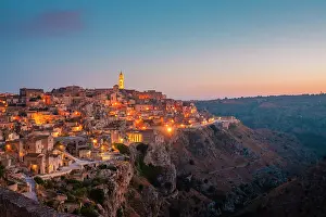 Basilicata Prints: Panoramic view of Sasso Caveoso of Matera at dusk. Matera, Basilicata, Italy