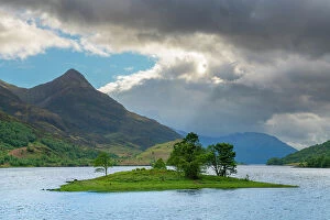 Images Dated 11th August 2022: Pap of Glencoe mountain peak rising above Seagull island on Loch Leven, Glencoe