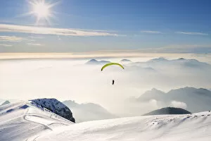 Images Dated 18th May 2021: Paragliding in Brescia prealpi in winter season, Brescia province, Lombardy district