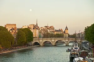 River Seine Prints: Paris, France. Locals enjoy a spring evening by the river Seine