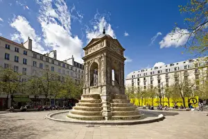 Paris, France. The sun shines on the Fountain des Innocents in the Place Joachim du