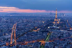 Images Dated 9th February 2023: Paris by night from above, streets and Tour Eiffel illuminated after sunset. France
