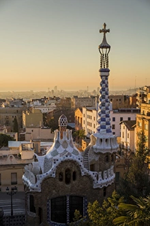 Gaudi Prints: Park Guell with city skyline behind at sunrise, Barcelona, Catalonia, Spain