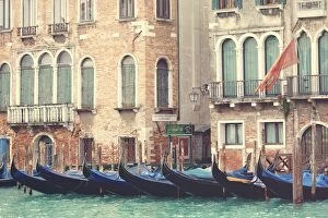 Parked gondolas along the Grand Canal of Venice, Veneto, Venice district, Italy