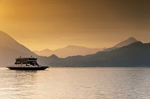 Images Dated 18th June 2014: Passenger ferry on Lake Como at sunset, Varenna, Lombardy, Italy