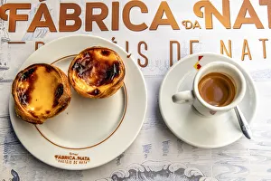 Images Dated 9th January 2019: Pastel de belem or pasteis de nata custard tarts served with a cup of coffee in a