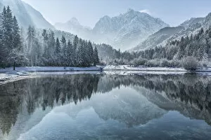 Images Dated 21st December 2020: Peaks of Prisojnik and Razor reflected in pools beside the Velika Pisnca River in winter