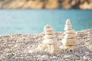 Images Dated 17th August 2022: Pebble Cairns on Myrtos Beach, Kefalonia, Ionian Islands, Greece