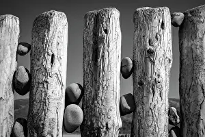 April Prints: Pebbles wedged between weathered groynes on Bossington Beach