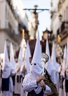 Penitents of Los Negritos Brotherhood taking part in processions during Semana