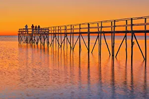 Prairie Province Prints: People gazing at sunrise on Iconic pier of Lake Winnipeg. Matlock, Manitoba, Canada