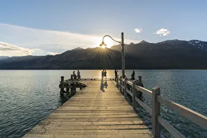 Dock Prints: People on the jetty on Lake Wakatipu just before sunset