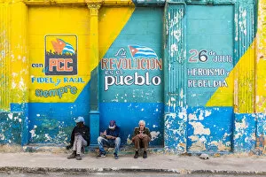 Images Dated 27th May 2020: People sitting on a street corner in La Habana Vieja (Old Town), Havana, Cuba