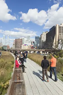 People walking on the High Line, a 1-mile New York City park on a section of former