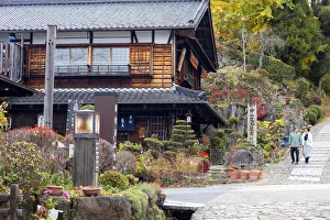 People walking along Nakasendo Way passing through Magome, Gifu Prefecture, Japan