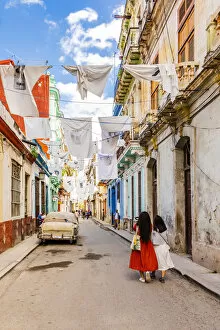 Images Dated 27th May 2020: People walking in a narrow street in La Habana Vieja (Old Town), Havana, Cuba