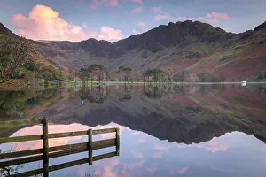 Perfectly still Lake Buttermere at sunset, Lake District National Park, Cumbria, England. Autumn (October) 2018