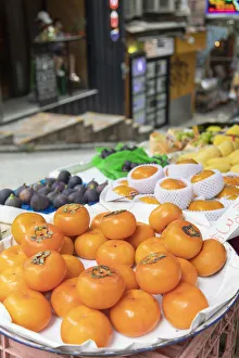 Market Stall Prints: Persimmons on fruit stall on Peel Street, Soho, Central, Hong Kong Island, Hong Kong