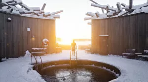 Person approaching the cold bath pool at sunset, Arctic Bath Spa and wellness Hotel, Harads, Lapland, Sweden