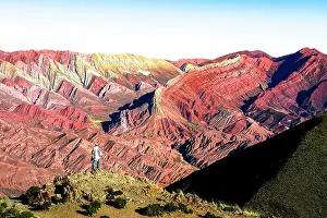 Exploration Prints: Person looking at vibrant rocks, Serrania de Hornocal, Humahuaca, Jujuy, Argentina. (MR)