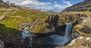 Images Dated 18th October 2021: Person observes Folaldafoss waterfall and Berufjordur during summer, Austurland