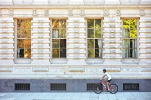 Recoleta Prints: A person riding a bike in front of the main facade of Palacio Sarmiento