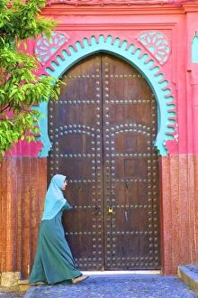 Female Collection: Person Walikng Infront Of Traditional Moroccan Decorative Door, Tangier, Morocco