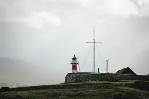 Images Dated 15th November 2022: A person walking towards Skansin lighthouse in Torshavn. Faroe Islands