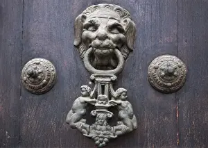 Iron Prints: Peru. A knocker decorates the wooden doors of Lima Cathedral