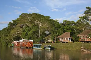 Thatched Cottages Prints: Peru. A tourist Lodge and two houseboats on the banks of the Madre de Dios River