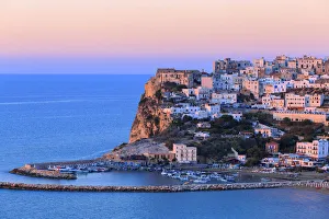 Gargano Prints: Peschici old town illuminated by sunset colors. Apulia(Puglia), Italy