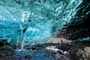 Photographer in Ice Cave, Iceland