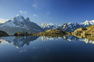 Trekker Prints: Photographers and hikers on the shore of Lac De Cheserys at dawn Haute Savoie France