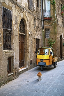 Pitigliano Prints: Piaggio Ape and a cat on a street in Pitigliano, Grosseto, Tuscany, Italy