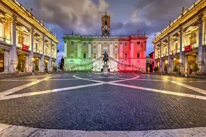 Piazza del Campidoglio with Palazzo Senatorio illuminated with the colors of the Italian