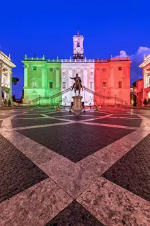 Piazza del Campidoglio with Palazzo Senatorio illuminated with the colors of the Italian