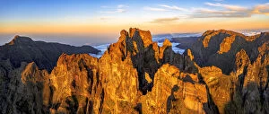 Images Dated 18th October 2021: Pico das Torres and Pico do Arieiro mountains lit by sunset, aerial view, Madeira island