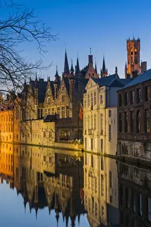 Picturesque blue hour view over Dijver canal with Belfort tower in the background