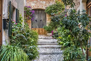 Adorned Prints: Picturesque cobbled street in the mountain village of Fornalutx, Majorca, Balearic