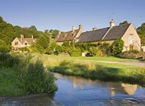 Picturesque farmhouses beside the River Eye in the Cotswolds village of Upper Slaughter
