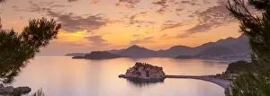 The picturesque island village of Sveti Stephan illuminated at sunset, Sveti Stephan