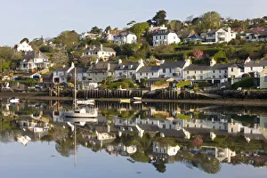 The picturesque South Hams village of Newton Ferrers, viewed from across the River The picturesque South Hams village of Newton Ferrers, viewed from across the River