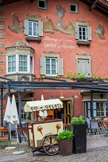 Chiusa Prints: Picturesque street corner with ice cream cart