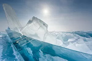 Pieces of transparent ice with sun reflection at lake Baikal, Irkutsk region, Siberia