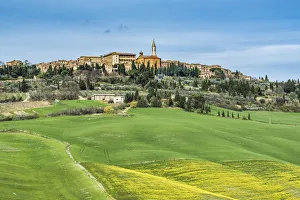 Pienza, Siena district, Tuscany, Italy. View of the green hills of Pienza with the Pienza, Siena district, Tuscany, Italy. View of the green hills of Pienza with the